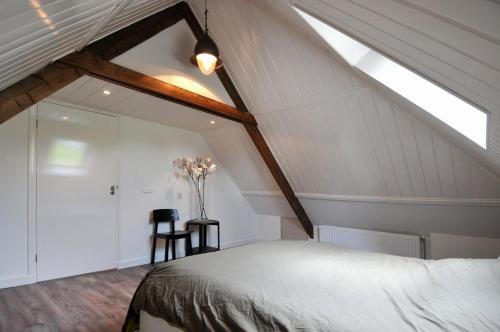 Un pat sau paturi într-o cameră la De Smidse