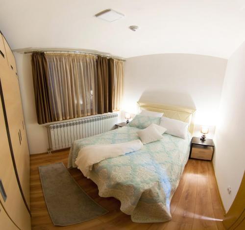 Postel nebo postele na pokoji v ubytování Vip Apartments Kopaonik