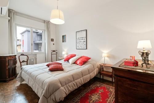 A bed or beds in a room at Condominio Torcello Vintage Apartment