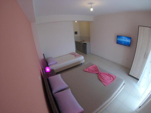 an overhead view of a living room with purple furniture at Riviera Rooms in Himare