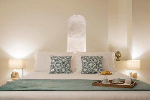 Postel nebo postele na pokoji v ubytování La Ripa Boutique Hotel