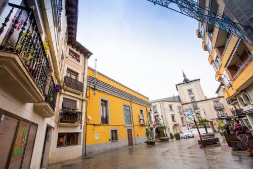 a group of buildings on a city street at APARTAMENTO CAPRICHOS ARANDA in Aranda de Duero