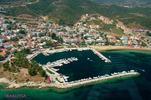 an aerial view of a town with a marina at Central Number 10 in Néa Péramos