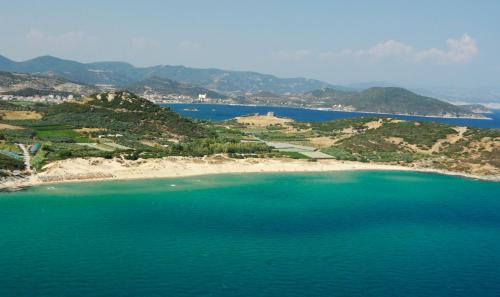an aerial view of a beach with blue water at Central Number 10 in Néa Péramos