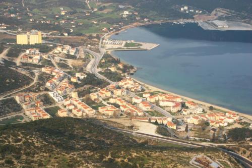 an aerial view of a town next to a body of water at Central Number 10 in Néa Péramos