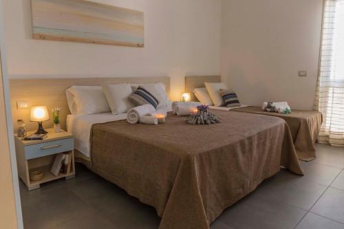 Postel nebo postele na pokoji v ubytování MareinSicilia: Appartamenti Larica