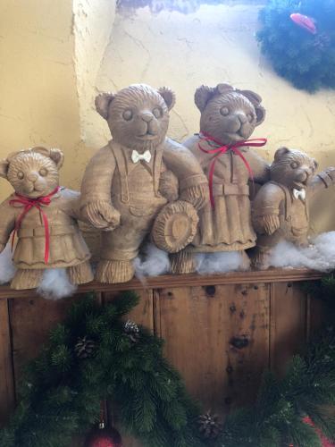 a group of teddy bears sitting on a shelf at Hôtel Restaurant de la Chaussée in Briançon