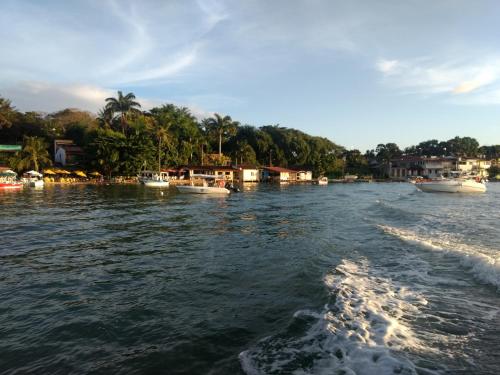 a view of a river with boats in the water at Sampeba in Ilha de Boipeba