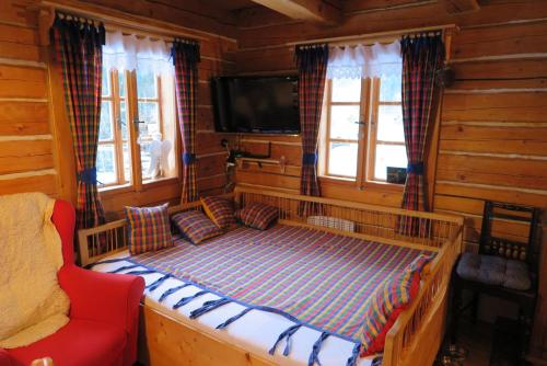 Giường trong phòng chung tại Roubenka U Milánka