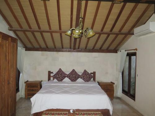 Gulta vai gultas numurā naktsmītnē Intan Mutiara Sanur Beach Villa