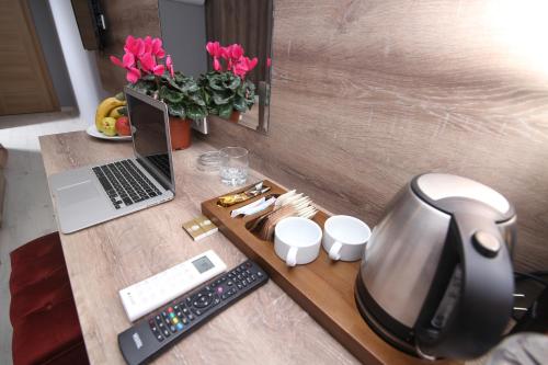 a desk with a laptop computer on top of it at kocatepe hotel in Ankara
