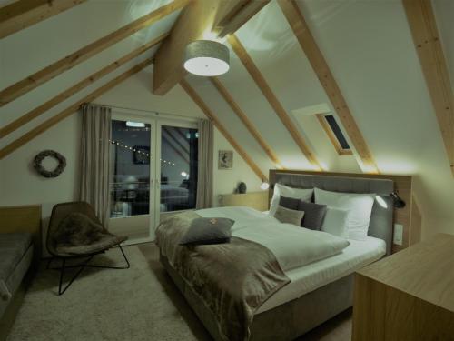 a bedroom with a large bed and a window at Dorfplatzl in Ischgl