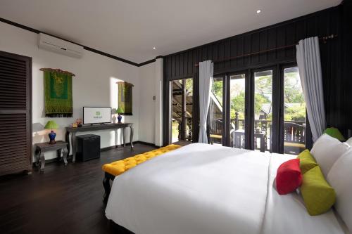Katil atau katil-katil dalam bilik di Sansan Resort