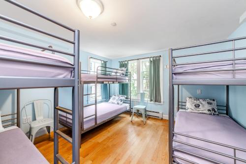 a room with three bunk beds in it at HI Hyannis Hostel in Hyannis