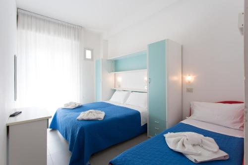 Postel nebo postele na pokoji v ubytování Hotel Savana