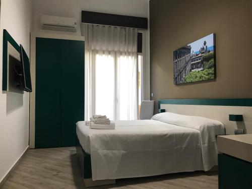 Krevet ili kreveti u jedinici u objektu Guesthouse Ughetti 21