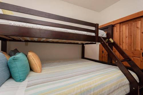 a bunk bed in a room with two bunk beds at Cabins 13 in Old Mammoth
