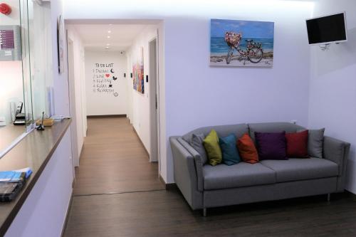 a living room with a couch and a coffee table at Color Suites Alicante in Alicante