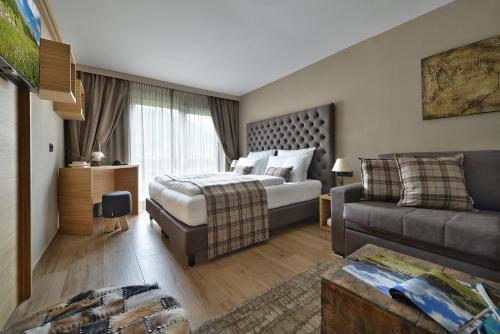 Ένα ή περισσότερα κρεβάτια σε δωμάτιο στο Hotel Margherita