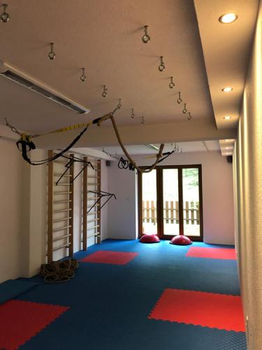 a room with colorful floors and lights on the ceiling at Frühstückspension Christina in Tux
