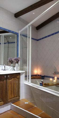 a bathroom with a sink and a large window at Casa Costaneira in Boiro