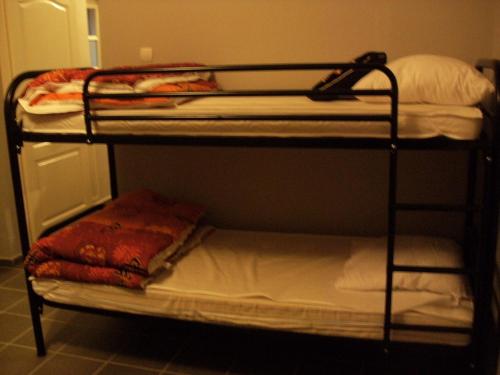 a couple of bunk beds in a room at 98 Petőfi utca in Balatonmagyaród