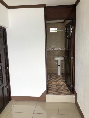 a bathroom with a toilet and a sink at Casa Imelda, Atitlan in Sololá