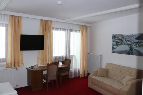 TV a/nebo společenská místnost v ubytování Hotel Rupertihaus