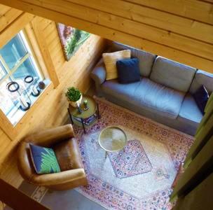 an overhead view of a living room with a couch at COSY & NATURAL *FIREPLACE*GARDEN*2 BIKES in Heinenoord