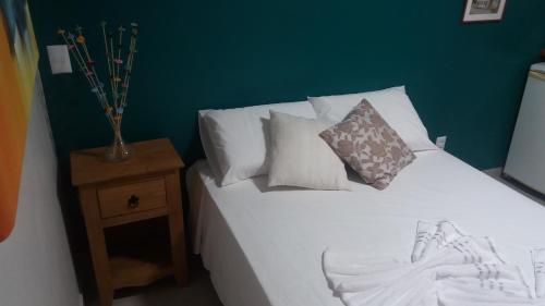 Un pat sau paturi într-o cameră la Casa em Santo Antônio de Lisboa