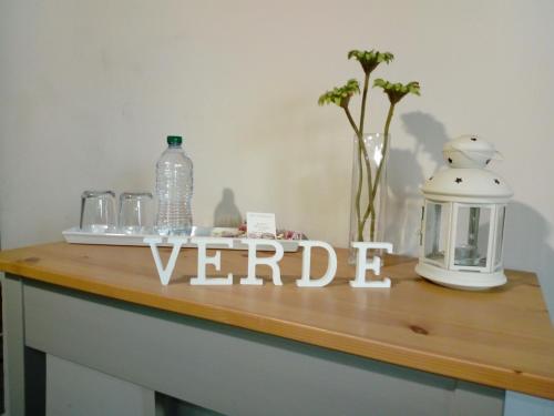 a wooden table with abard with aented wordeder on it at Nelle Stanze Del Matese in Boiano