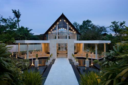 an exterior view of a villa with a restaurant at The Kunja Villa-Hotel in Seminyak