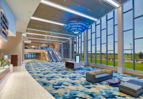 a lobby with a large carpeted floor and large windows at Mystic Lake Casino Hotel in Prior Lake