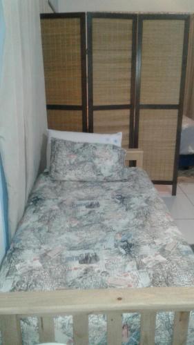 a bed in a room with a bedspread on it at 36 Df Strauss Street in Kleinmond