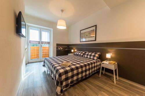Postel nebo postele na pokoji v ubytování parina Inn – Locanda