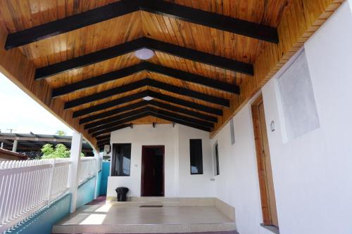 a wooden roof on a building with a porch at Holiday Hire Fiji in Lautoka