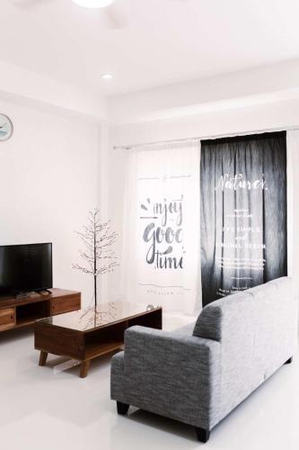 a living room with a couch and a coffee table at 1949 Dreamy Home in Panglao