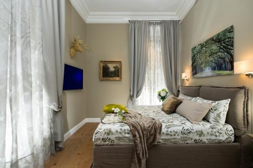 a bedroom with a bed and a window at Marvellous apt near Vatican in Rome