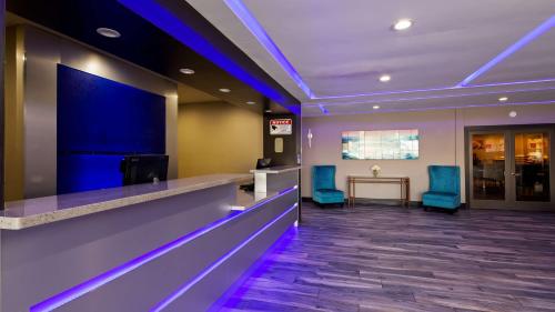 a waiting room at a hospital with blue lights at SureStay Plus Hotel by Best Western Point Richmond in Richmond