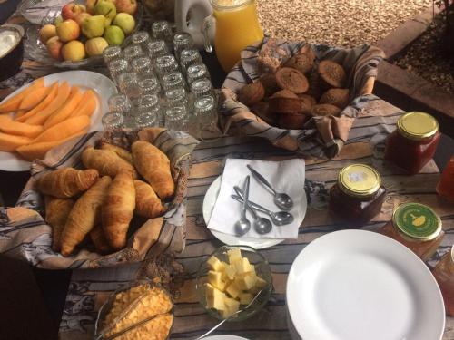 a table topped with lots of different types of food at Kudu Ridge Game Lodge in Addo