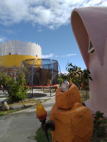 a fire hydrant in front of a playground at Kenting Ha-Bi Star Fort in Hengchun