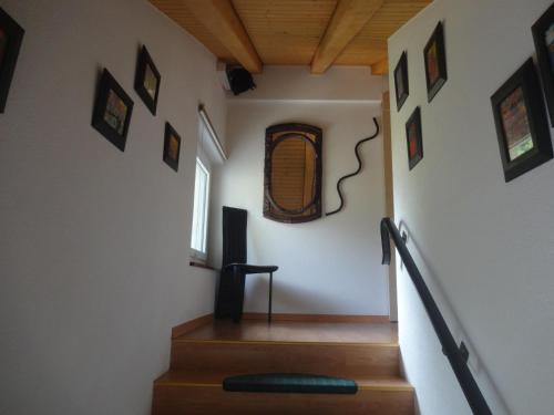 a room with stairs with a speaker and a window at Artist Apartments & Hotel Garni in Zermatt