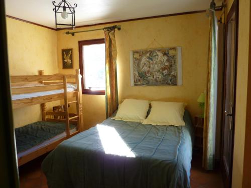 a small bedroom with a bed and a window at Gîte des Gorges du Bruyant in Saint-Nizier-du-Moucherotte