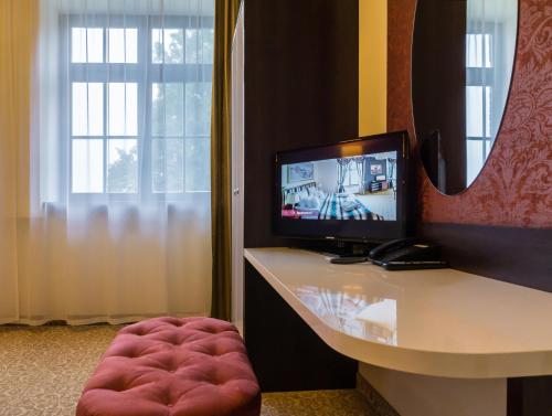 TV a/nebo společenská místnost v ubytování Hotel Zamek Gniew