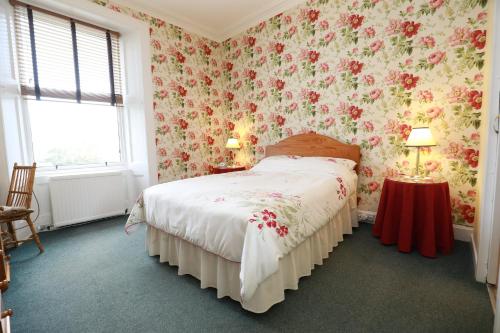 Ένα ή περισσότερα κρεβάτια σε δωμάτιο στο Rockhill Guest House