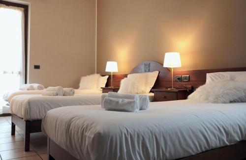 Postel nebo postele na pokoji v ubytování Hotel Ristorante Château