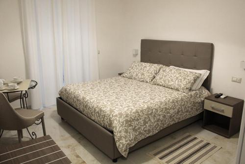 מיטה או מיטות בחדר ב-Antonietta De Pace Rooms by Napoli Milionaria B&B