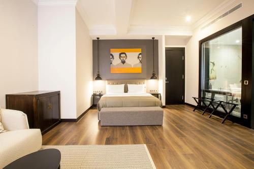 a bedroom with a bed and a living room at Quentin XL Potsdamer Platz in Berlin