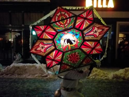 a teddy bear holding a stained glass umbrella at Apartmenthaus Hinterer in Bad Goisern