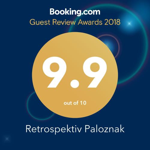 a poster for the quest review awards with a yellow circle at Paloznak Retrospektív in Paloznak